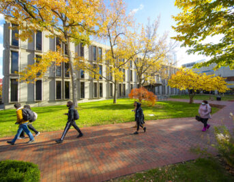 Original Caption:  Students walk to class on Newark campus